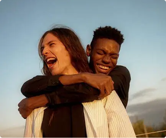 Couple smiling together outdoors